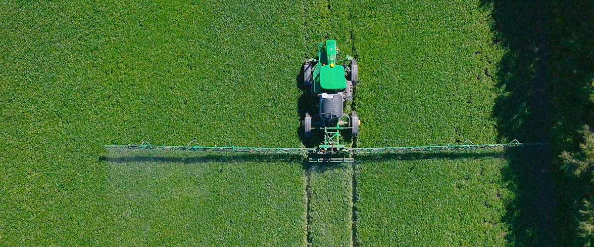 overhead view of a sprayer in a field